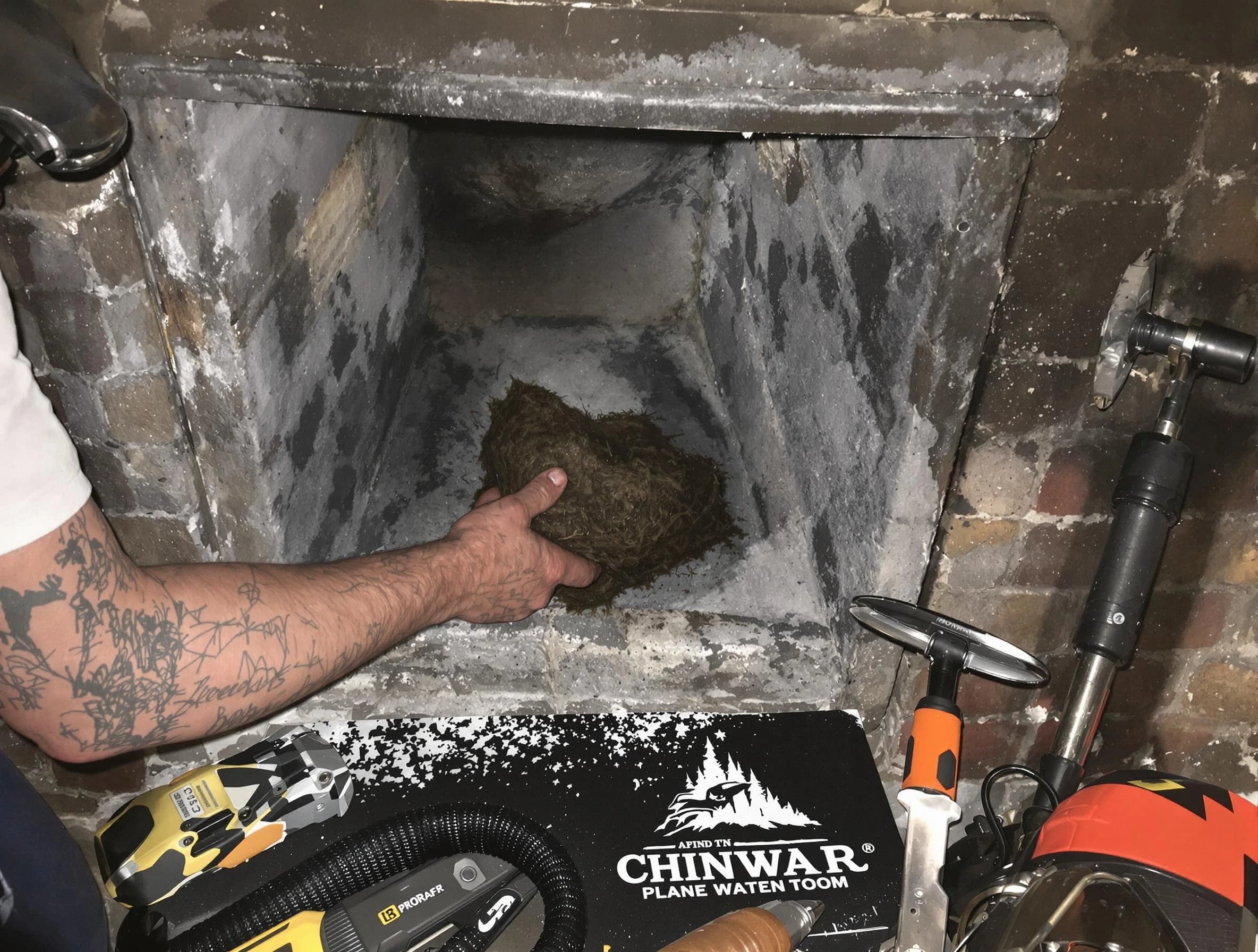 Hazlet Chimney Sweep safely removing debris and screening chimney in Hazlet, NJ