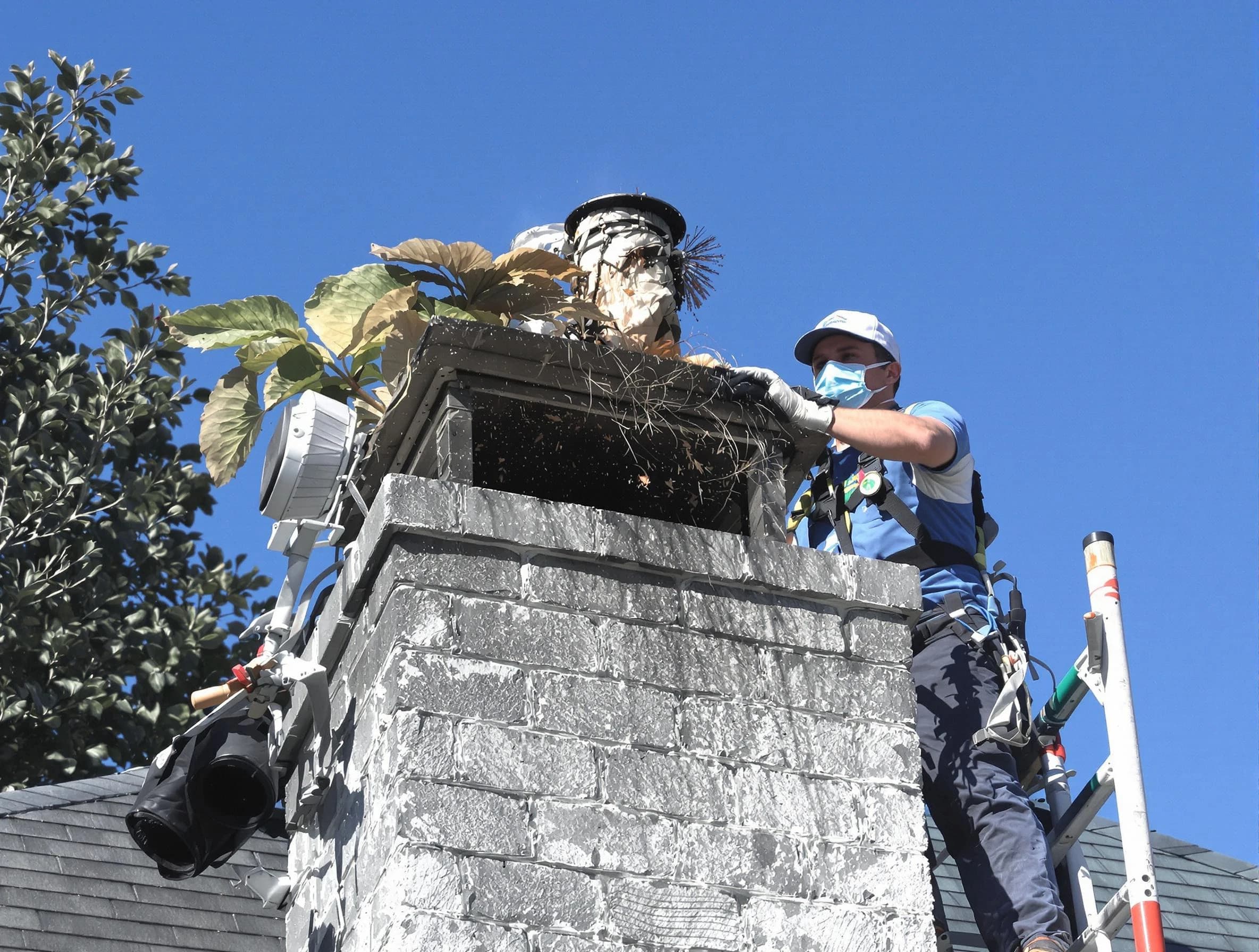 Hazlet Chimney Sweep specialist performing chimney cleaning in Hazlet, NJ
